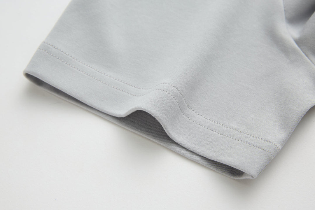 Light gray T-shirt sleeve hem with double-stitched edge