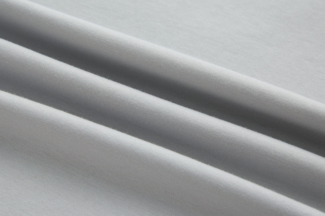 Light gray T-shirt knit fabric texture close-up