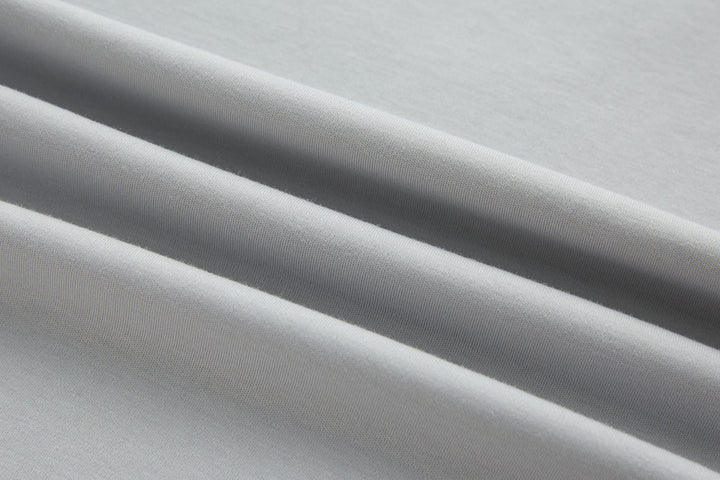 Light gray T-shirt knit fabric texture close-up