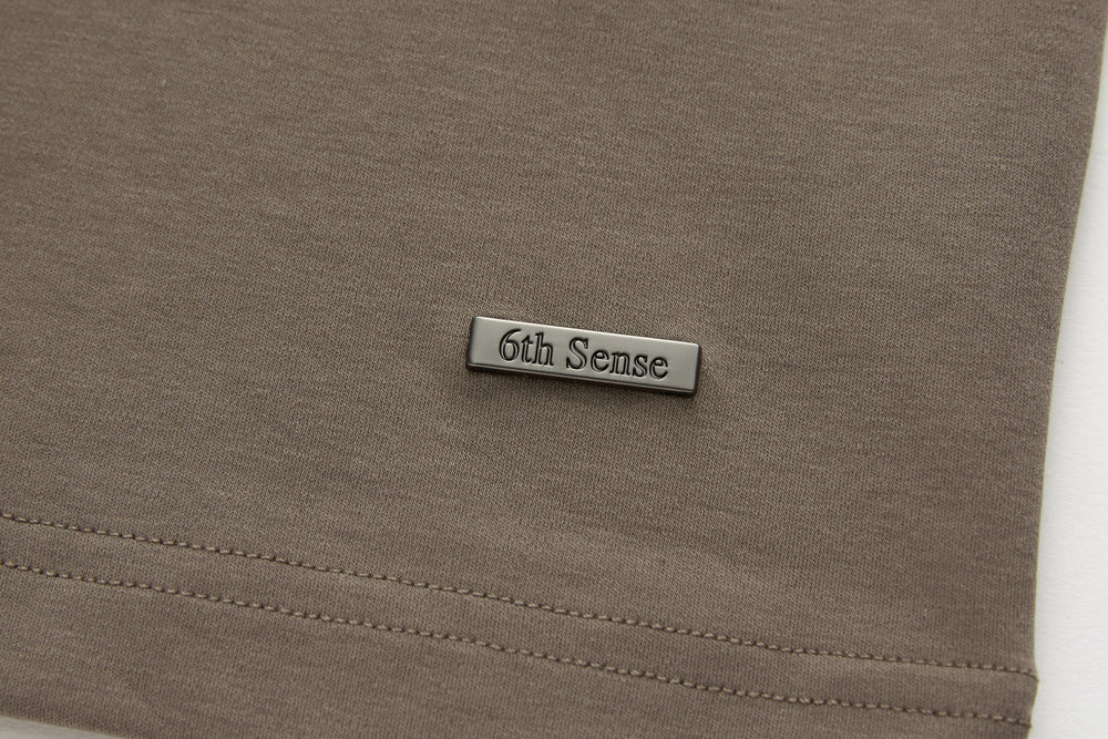 Walnut brown t-shirt with 6th Sense logo patch and stitched hem seam