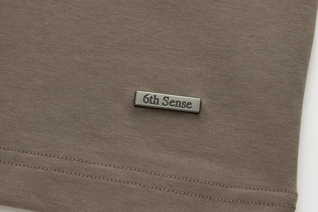 Walnut brown t-shirt with 6th Sense logo patch and stitched hem seam