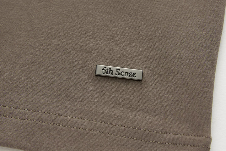 Walnut brown t-shirt with 6th Sense logo patch and stitched hem seam