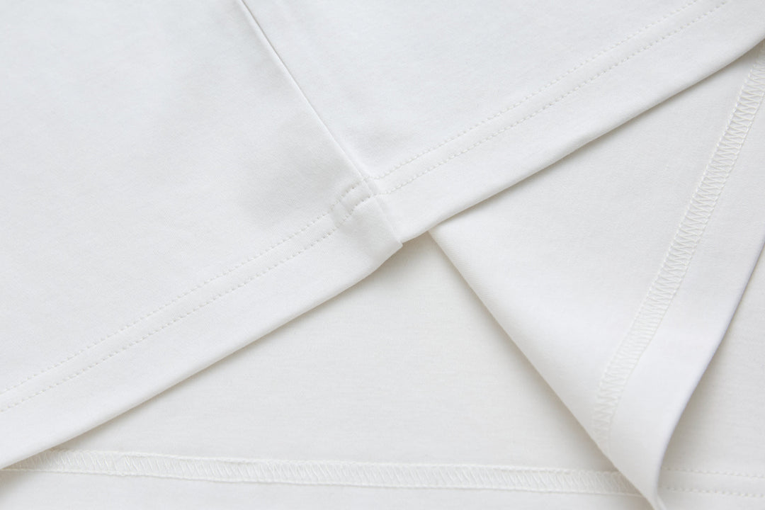 White crewneck T-shirt, close-up of stitched shoulder seams