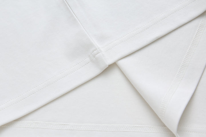 White crewneck T-shirt, close-up of stitched shoulder seams