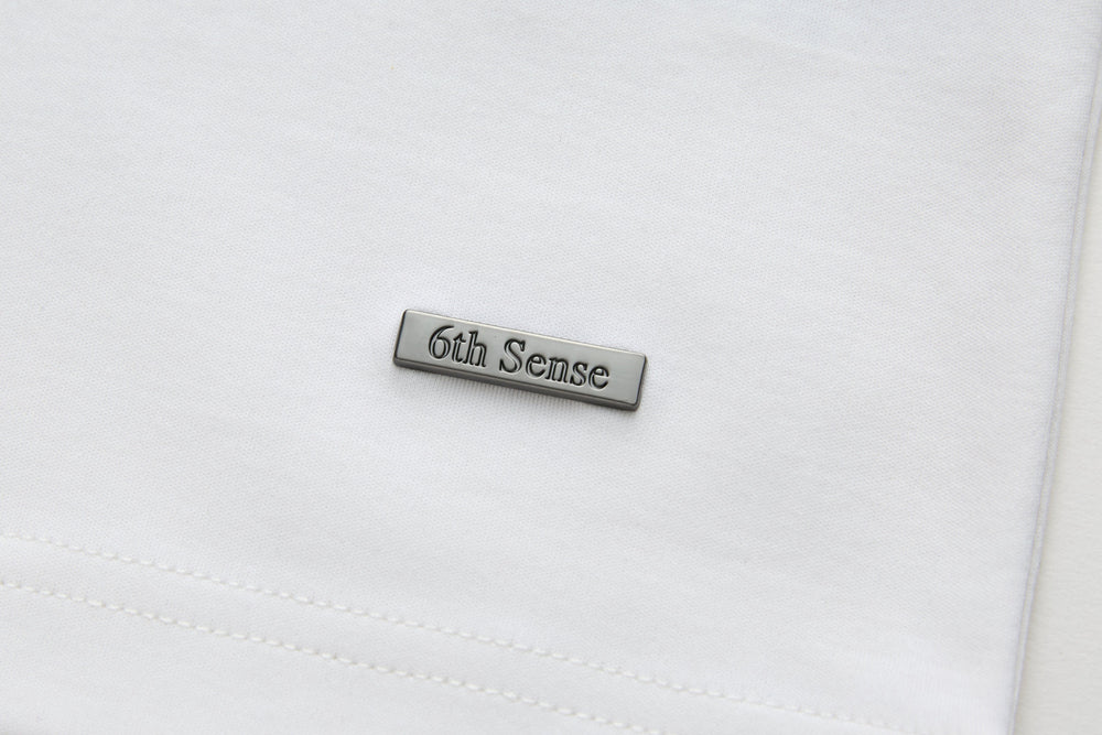 White crewneck T-shirt with 6th Sense stitched logo label