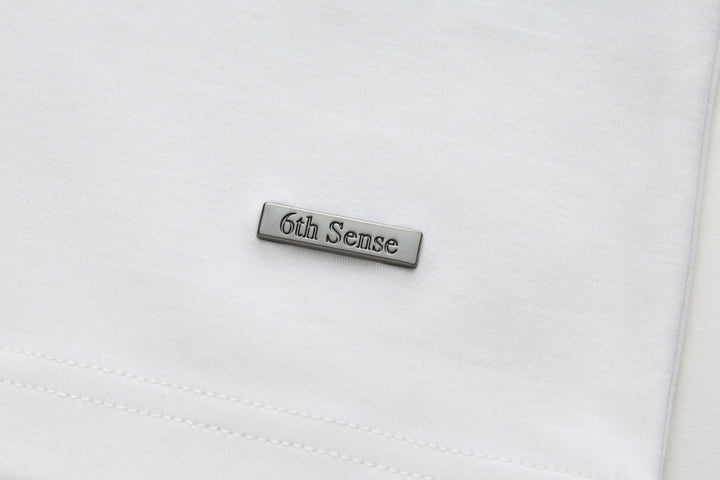 White crewneck T-shirt with 6th Sense stitched logo label