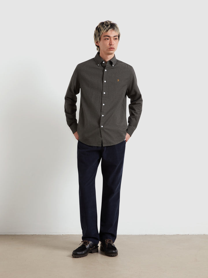 Dark charcoal long-sleeve button-up shirt with white buttons and spread collar