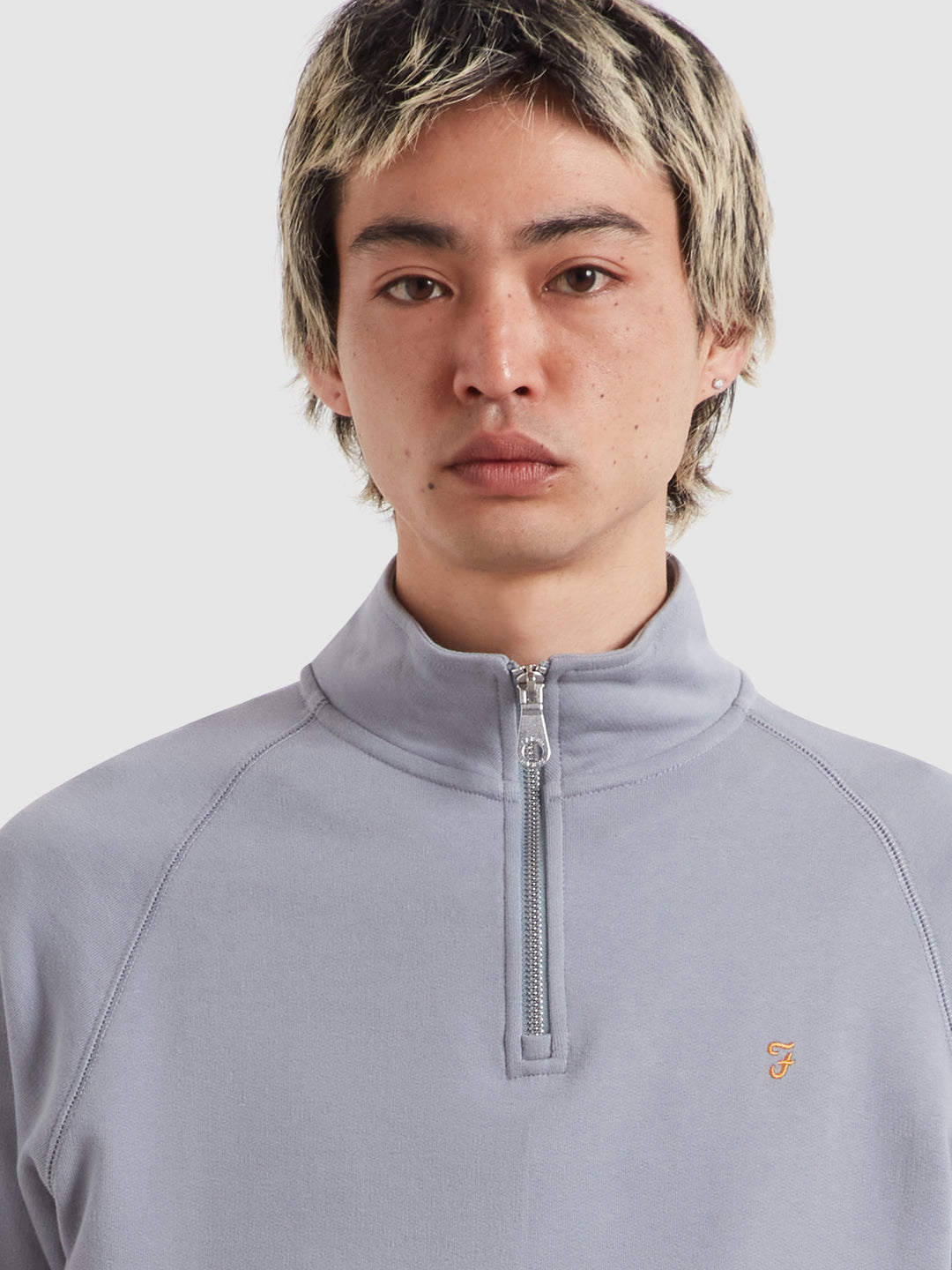 Farah Arnold quarter-zip top, front view with half-length zipper, light blue