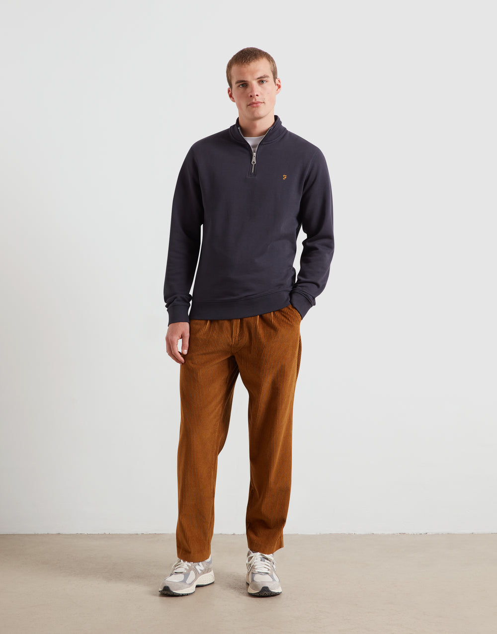 Navy 1/4-zip sweatshirt top with long sleeves and small chest logo