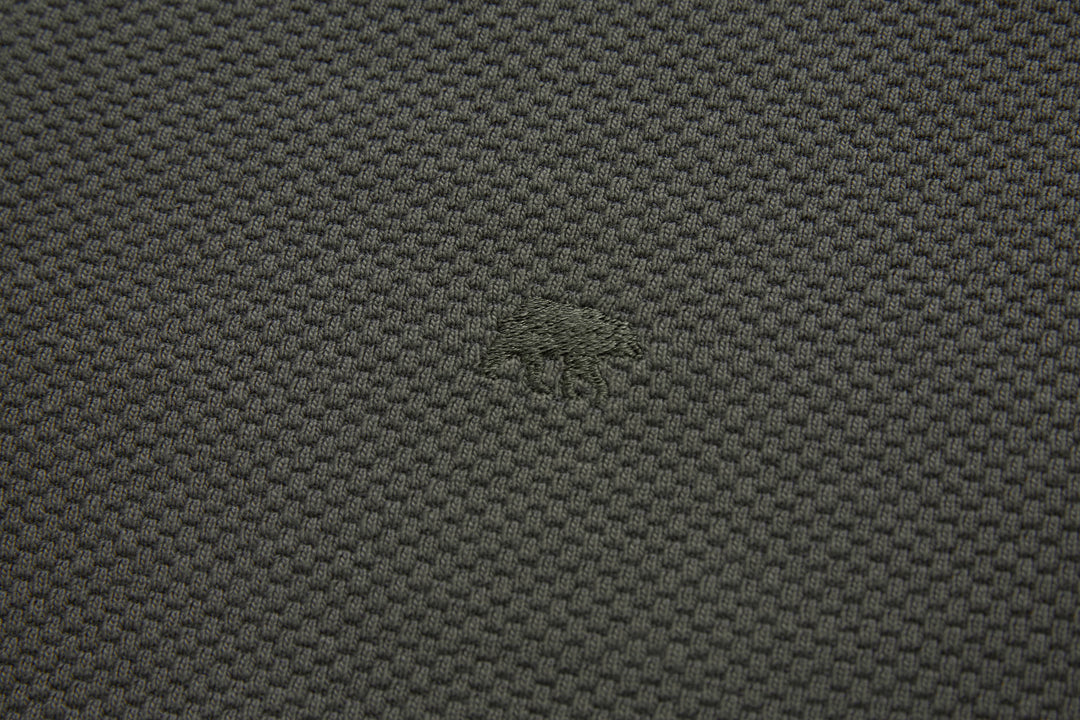 Grey 1/4-zip top fabric close-up with textured woven pattern