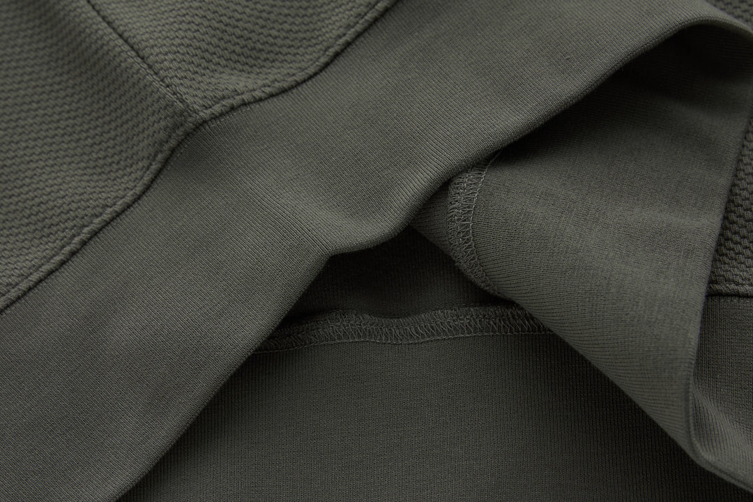 Grey 1/4-zip top hem detail with ribbed cuffs and inner lining