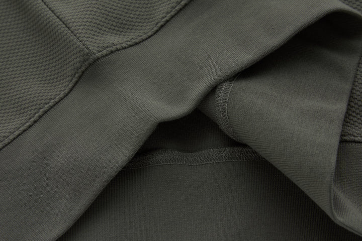 Grey 1/4-zip top hem detail with ribbed cuffs and inner lining