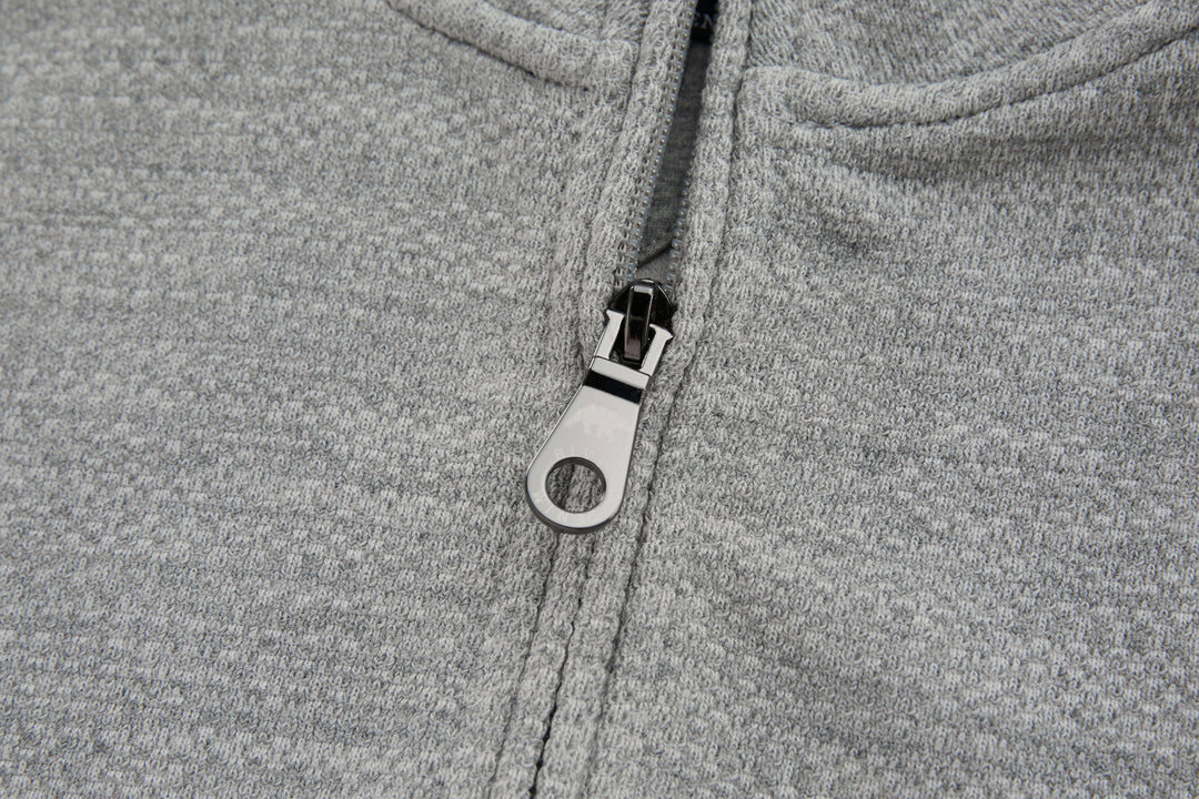 1/4-zip top zipper pull with dark pull tab and metal zipper teeth