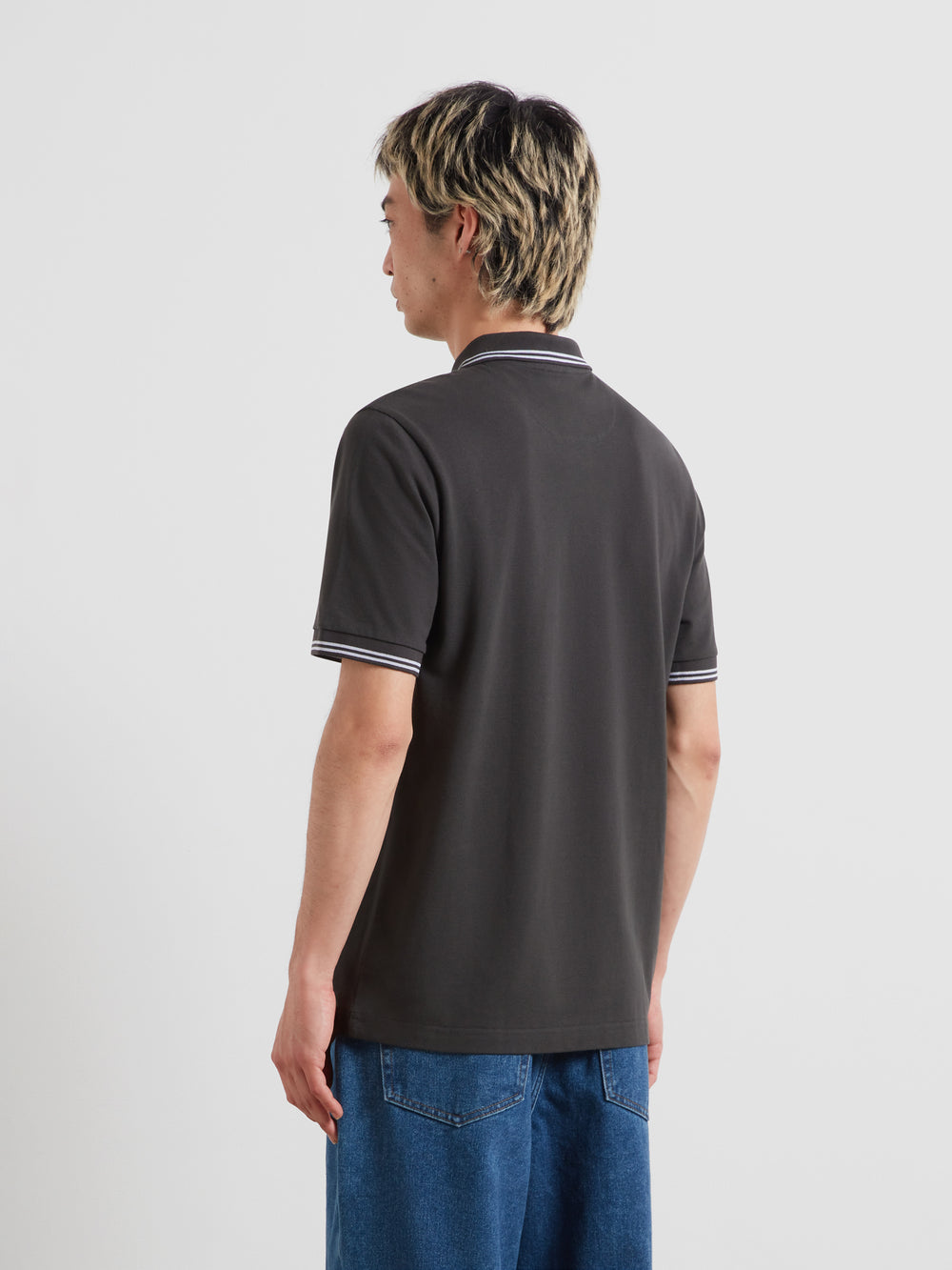 Farah washed black polo shirt, back view with striped trim at collar and cuffs