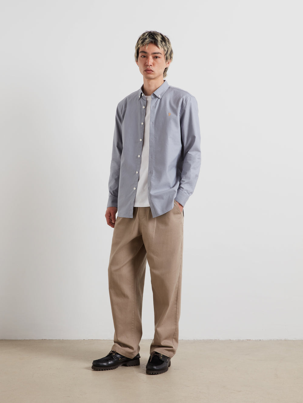 Men's slim-fit light blue Oxford button-up shirt, long sleeves, button-front.