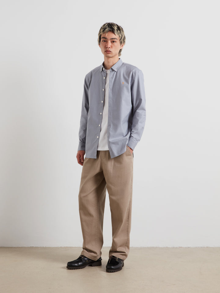 Men's slim-fit light blue Oxford button-up shirt, long sleeves, button-front.