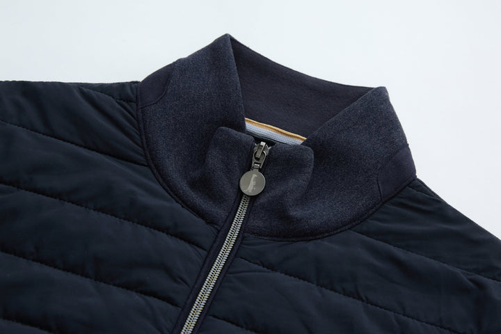 Navy hybrid jacket hood collar with zip-up front and metal zipper pull