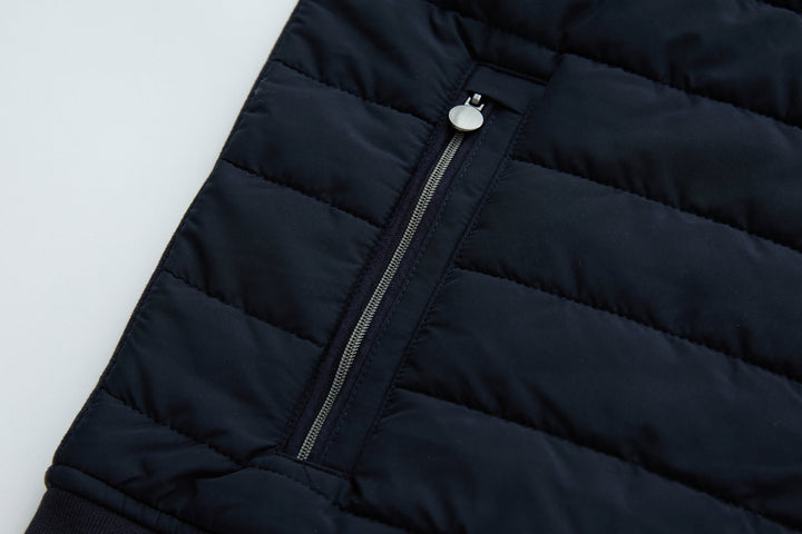 Navy hybrid jacket front with stand collar and vertical zipper