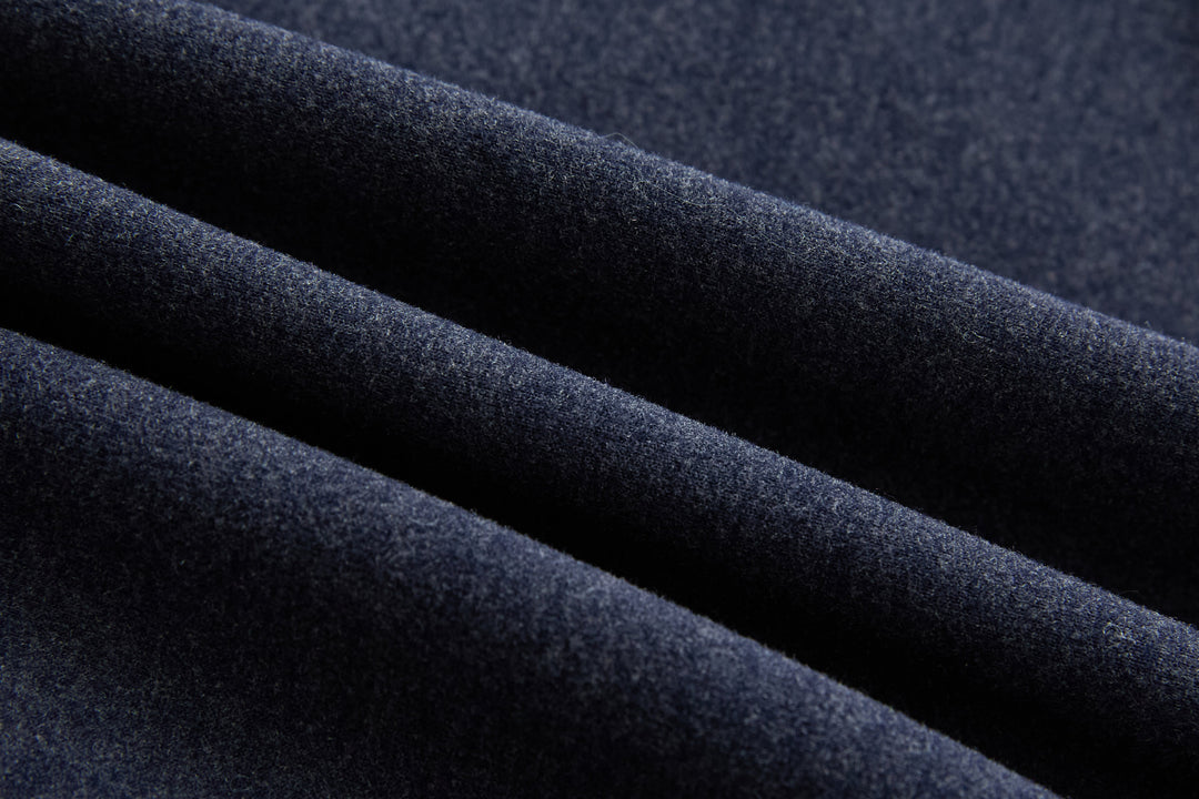 Navy hybrid jacket fabric close-up with quilted outer texture