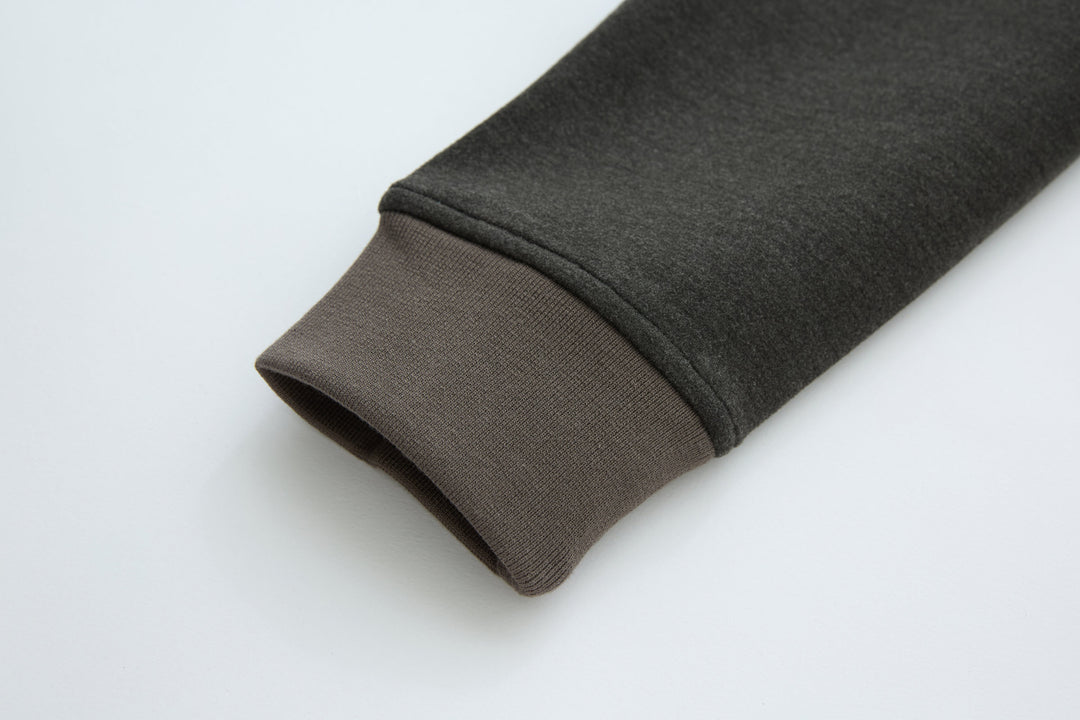 Rib-knit sleeve cuff in dark fabric