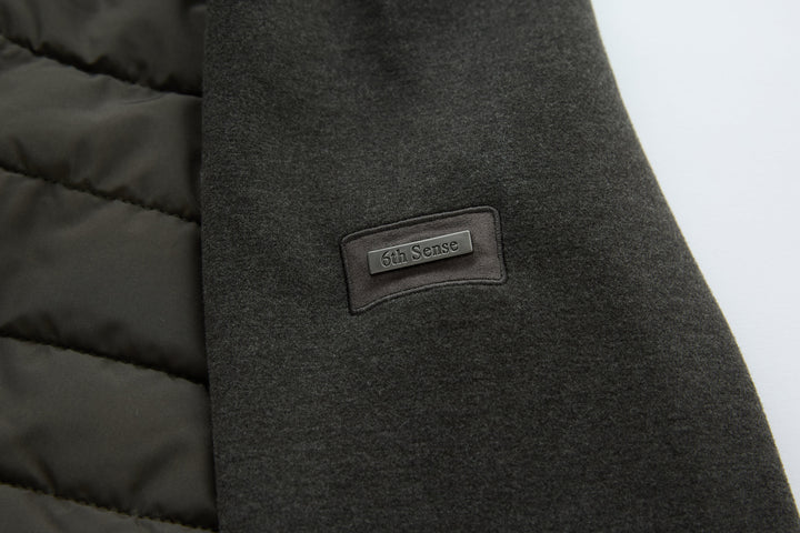 Hybrid jacket with dark knit panel and 6th Sense logo patch detail