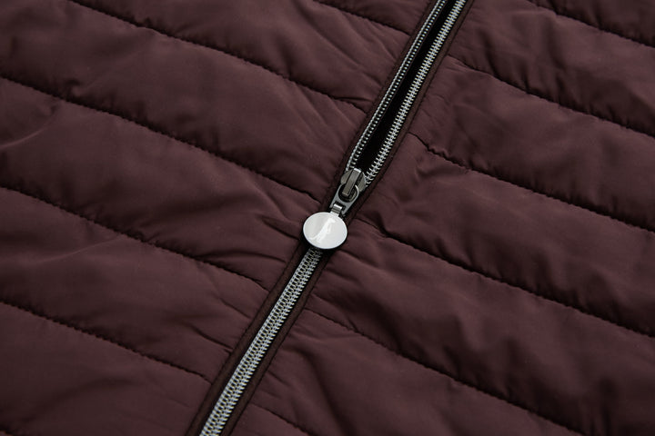 Plum zip pull and metal zipper on quilted jacket front