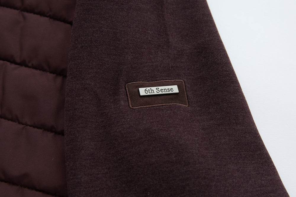6th Sense logo patch on plum hybrid jacket shoulder