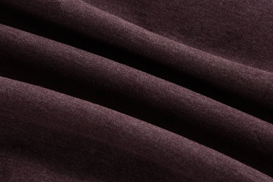 Plum hybrid jacket fabric close-up, quilted panels texture