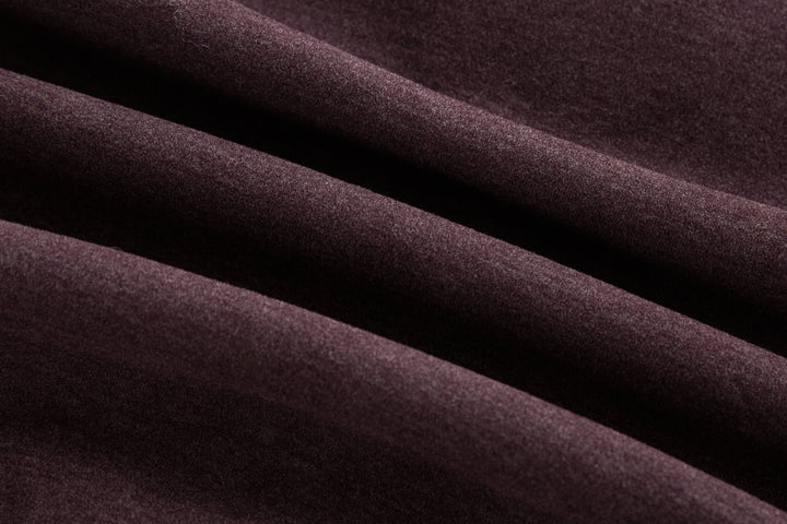 Plum hybrid jacket fabric close-up, quilted panels texture