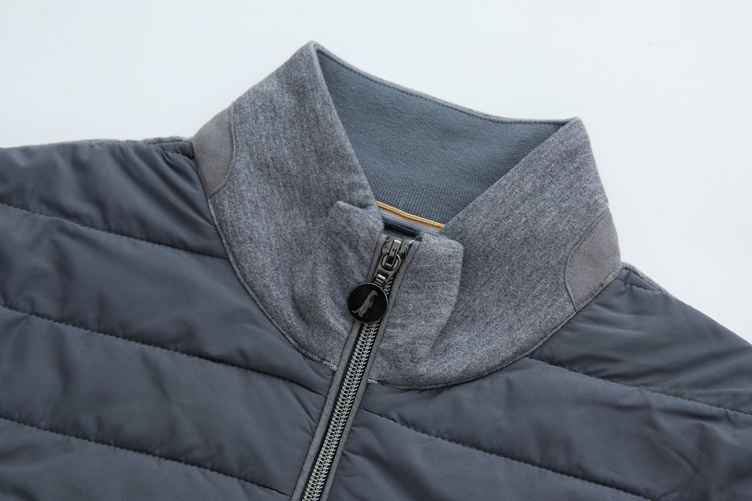 Hybrid jacket with gray hood collar and front zipper, dark quilted body