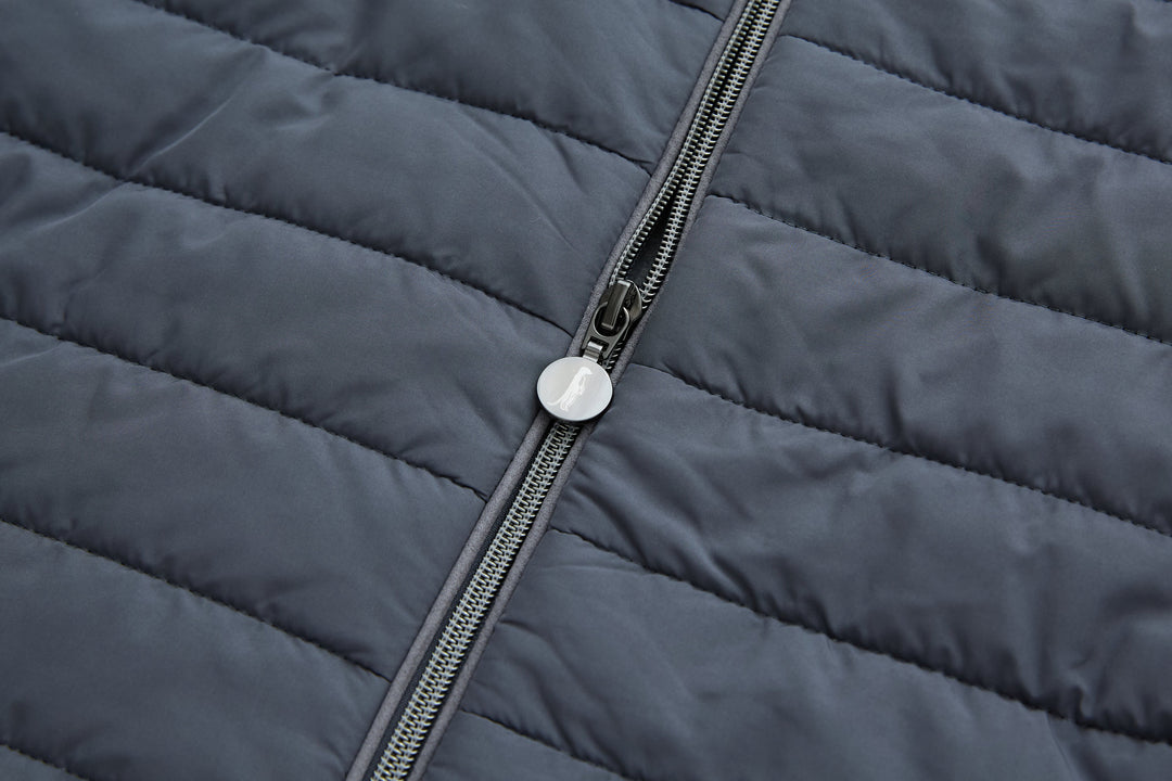 Hybrid jacket front zipper detail on dark quilted shell