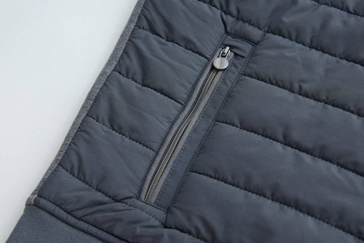 Hybrid jacket side zipper pocket and dark quilted panel