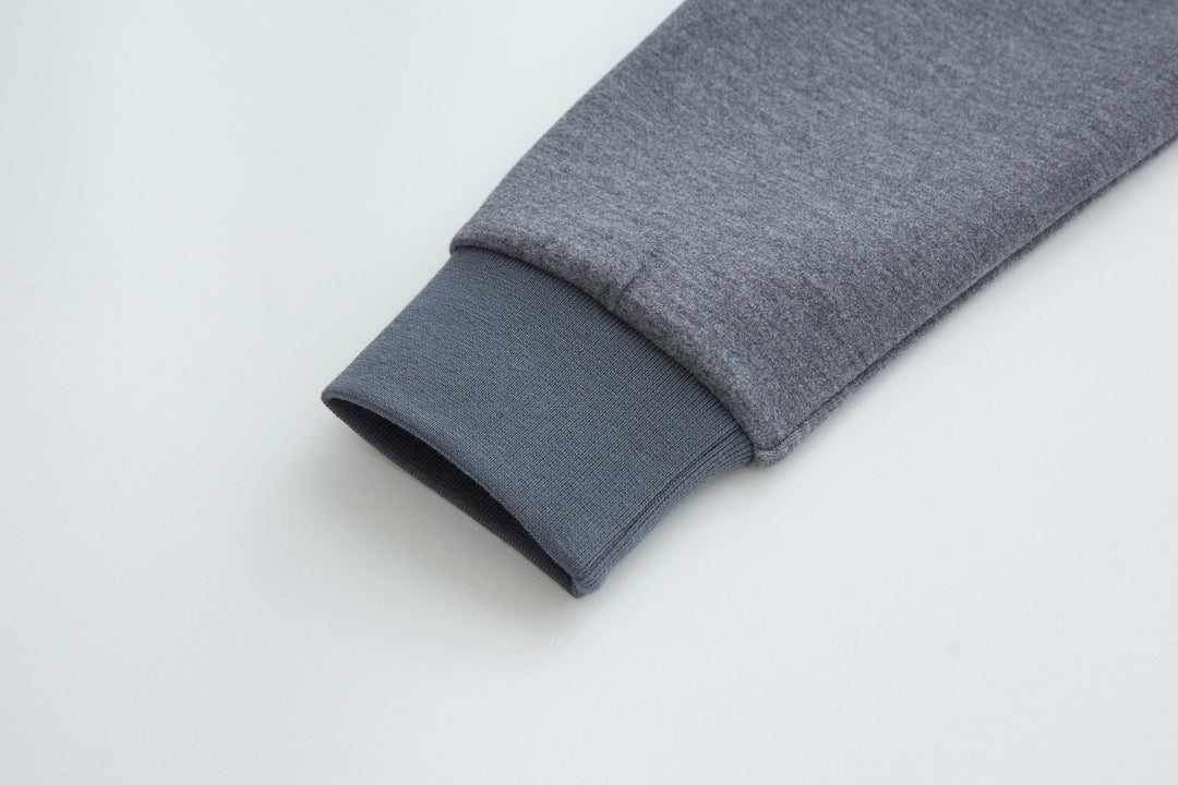 Hybrid jacket sleeve cuff in gray knit, folded hem
