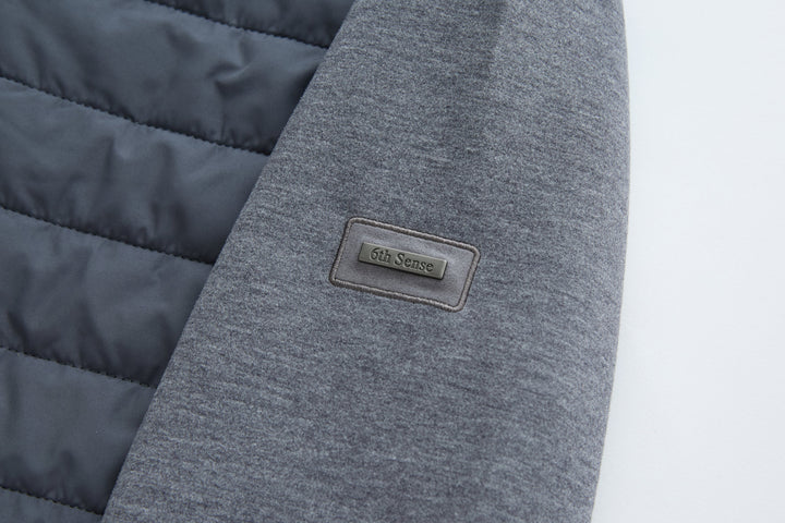 6th Sense hybrid jacket logo patch on gray knit sleeve