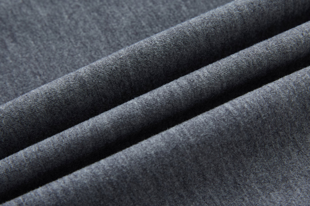 Hybrid jacket fabric close-up, textured gray knit panel
