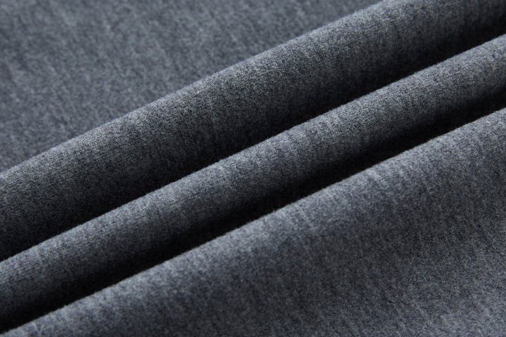 Hybrid jacket fabric close-up, textured gray knit panel