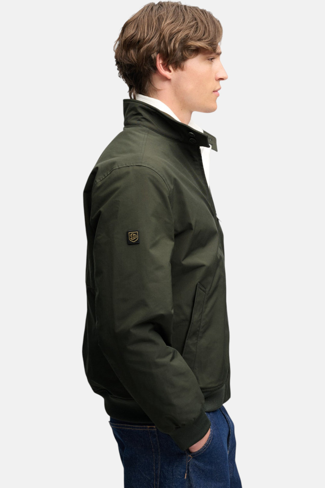 Olive green padded Harrington jacket with sleeve badge patch and zip front