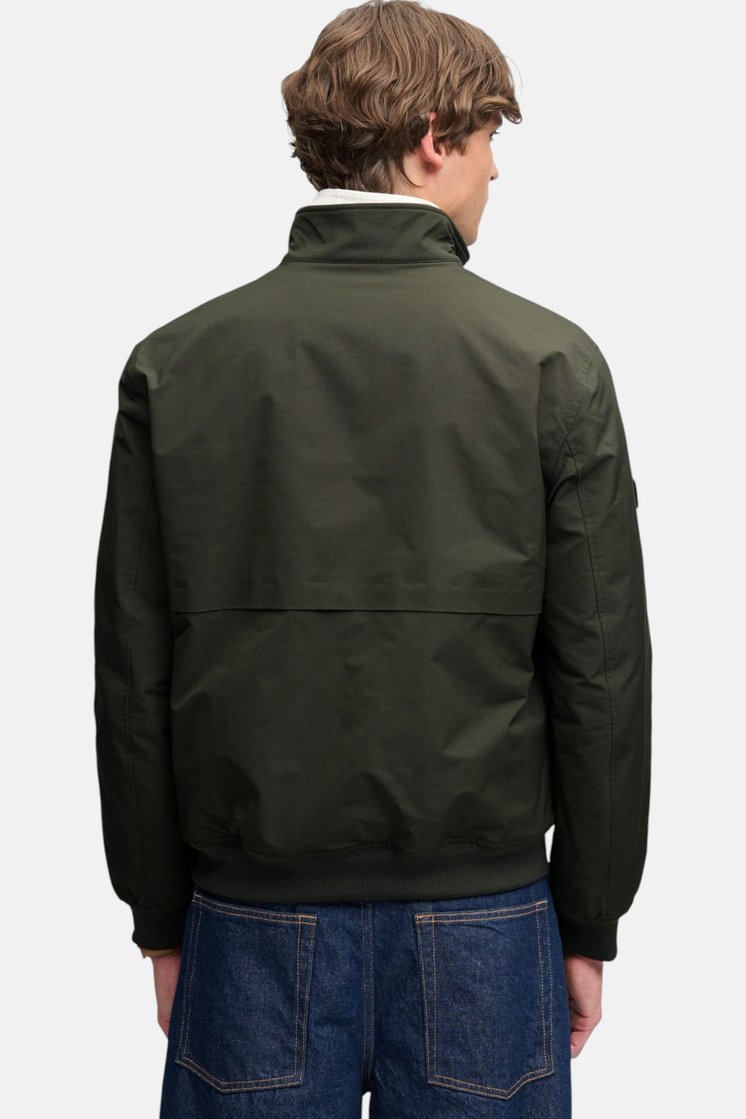 Olive green padded Harrington jacket, back view with stand collar and elastic cuffs