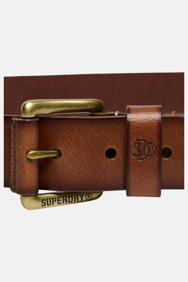 Tan leather belt with brass buckle bar, embossed logo plate and punched holes