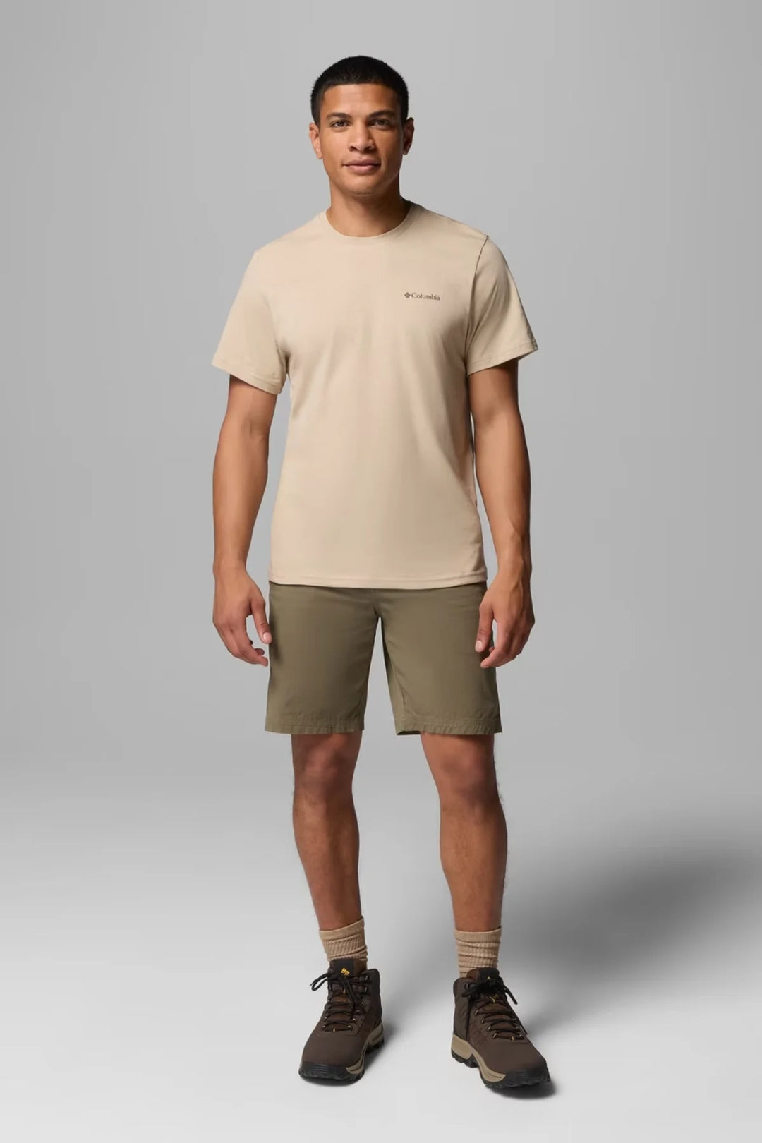 Tan crew-neck T-shirt with small chest logo, short sleeves