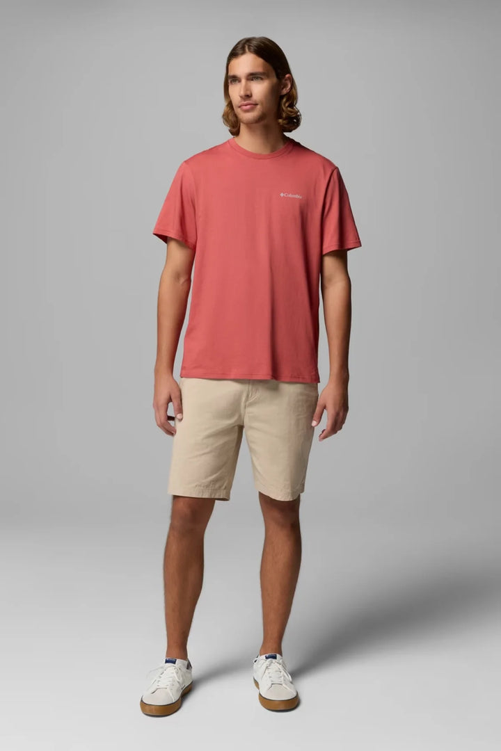 Washed red crewneck T-shirt worn with tan shorts