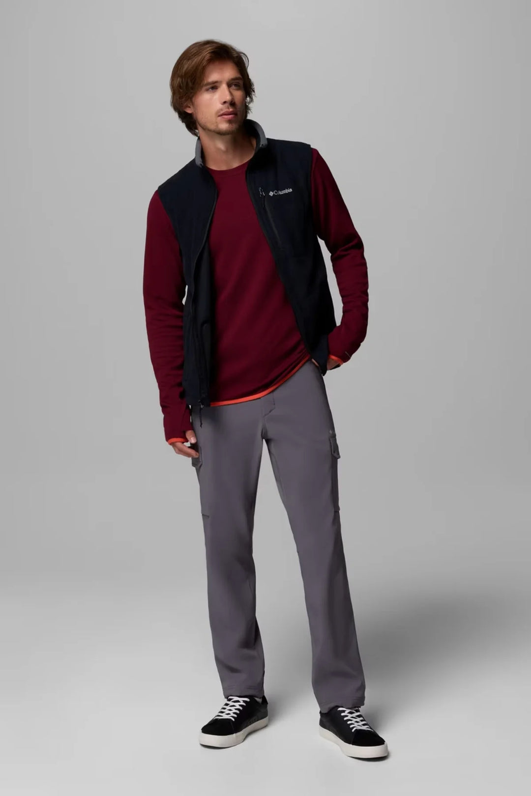 Dark fleece vest with front zipper, stand collar, and side hand pockets