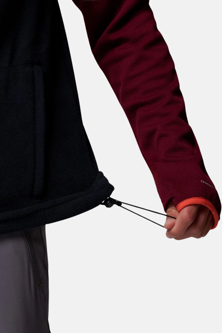 Black fleece vest with adjustable drawcord hem and zipper pull detail