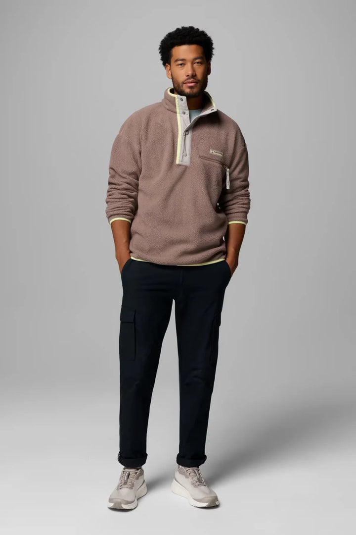 Half-snap fleece pullover, taupe-brown, worn with dark pants and ribbed cuffs