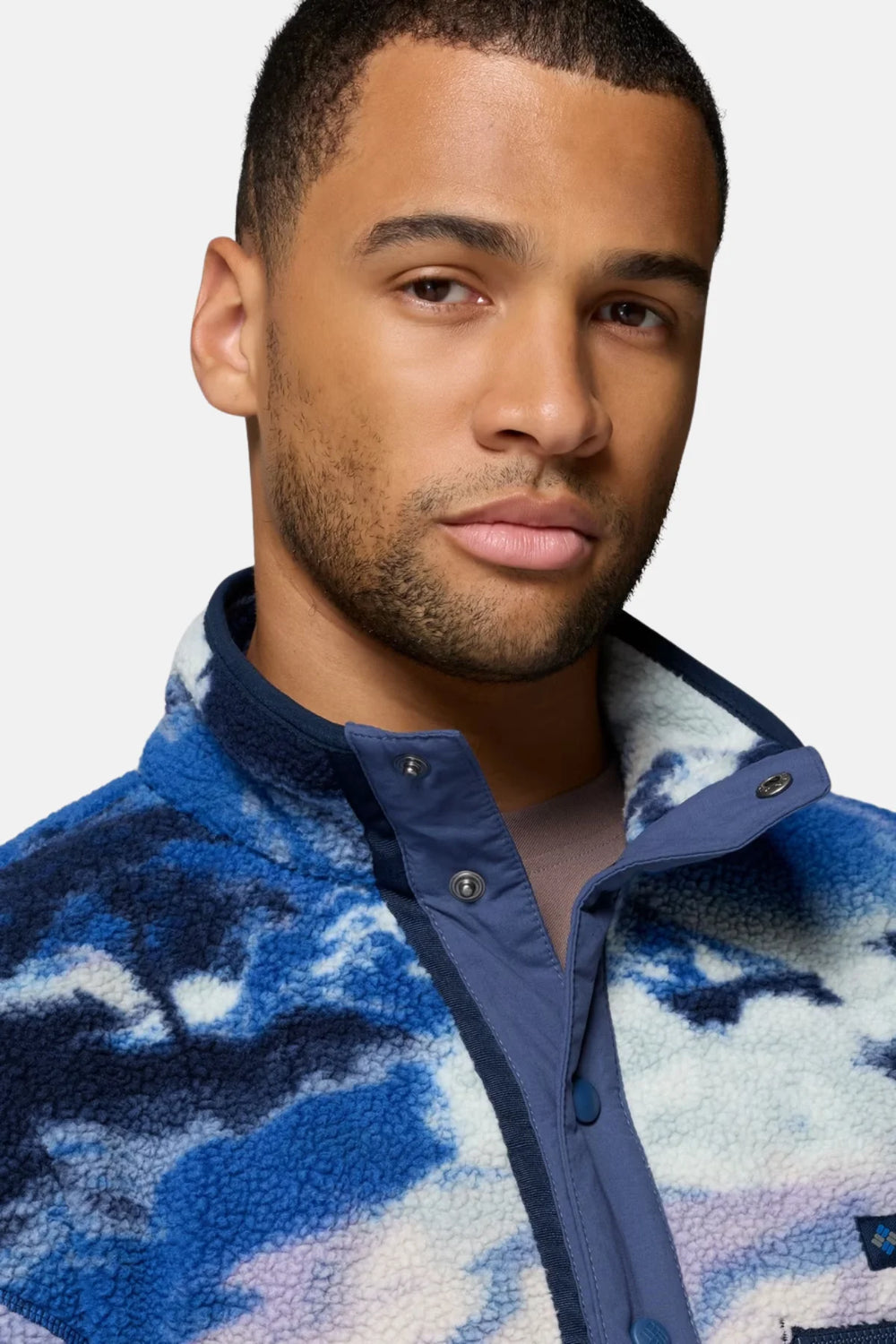 Printed half-snap fleece pullover, blue and white cloud pattern, close-up of snap placket