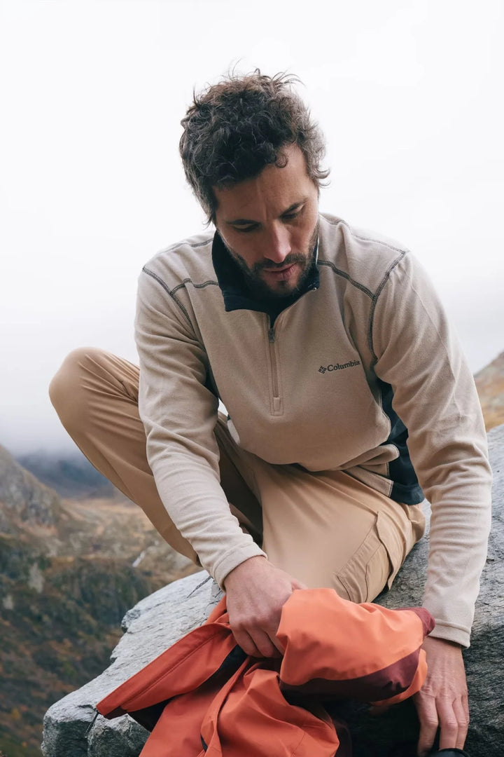 Half-zip fleece top, beige fleece with dark paneling and half-zip placket