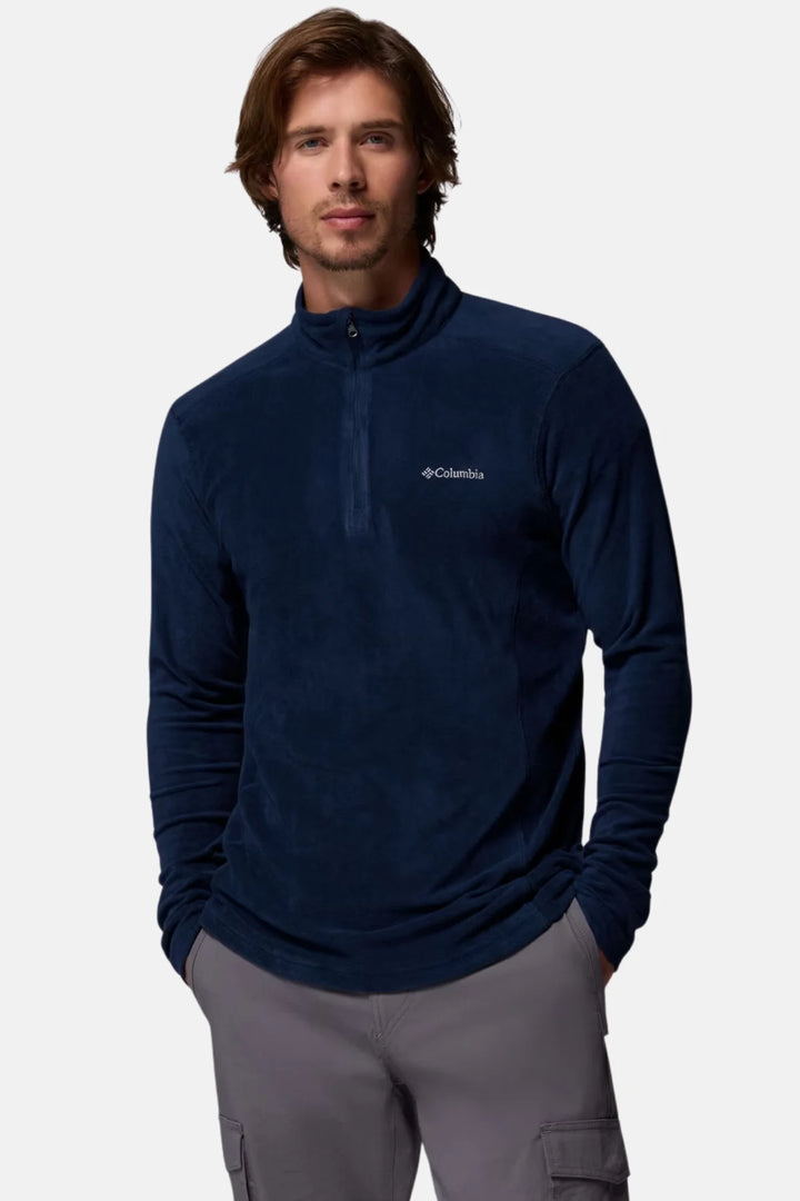 Navy half-zip fleece top with high collar and small chest logo