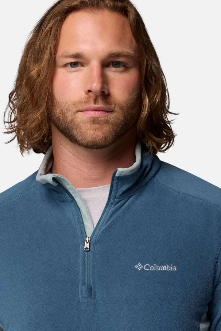 Blue half-zip fleece top close-up, stand collar with zipper and Columbia chest logo