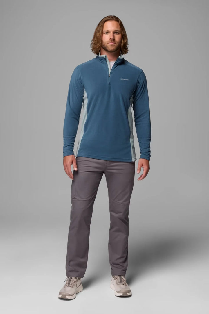 Blue half-zip fleece top with long sleeves and mock neck, chest logo