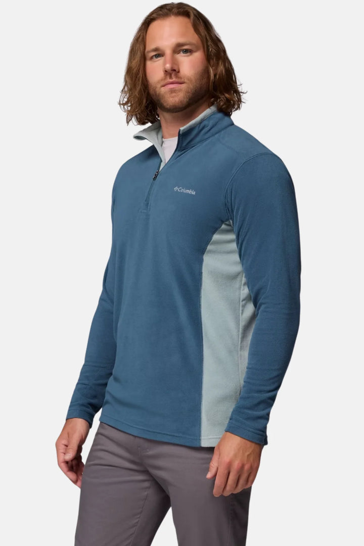 Blue half-zip fleece top, long sleeves and stand collar with zipper, chest logo